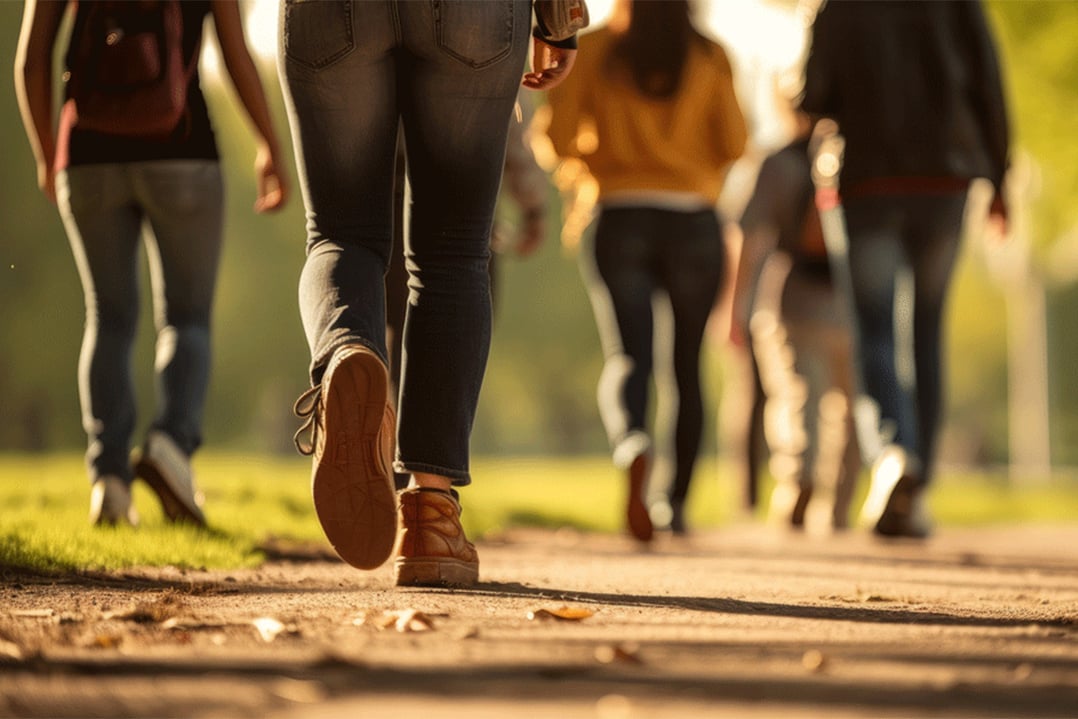group-of-people-walking-in-a-green-park