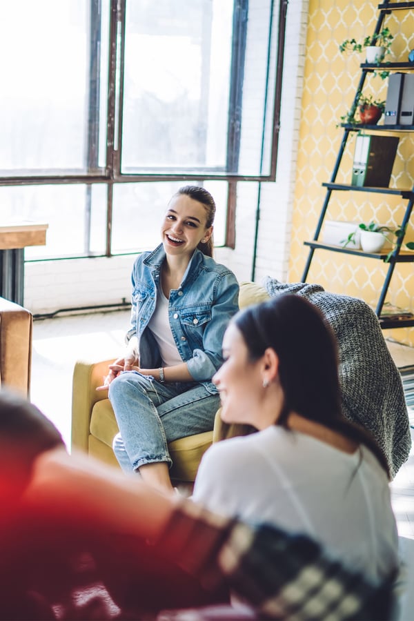 group-of-teenagers-conversating-indoors