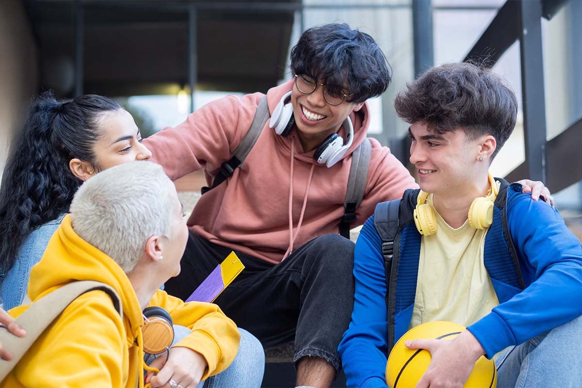 happy-group-of-diverse-high-school-kids-hanging-out
