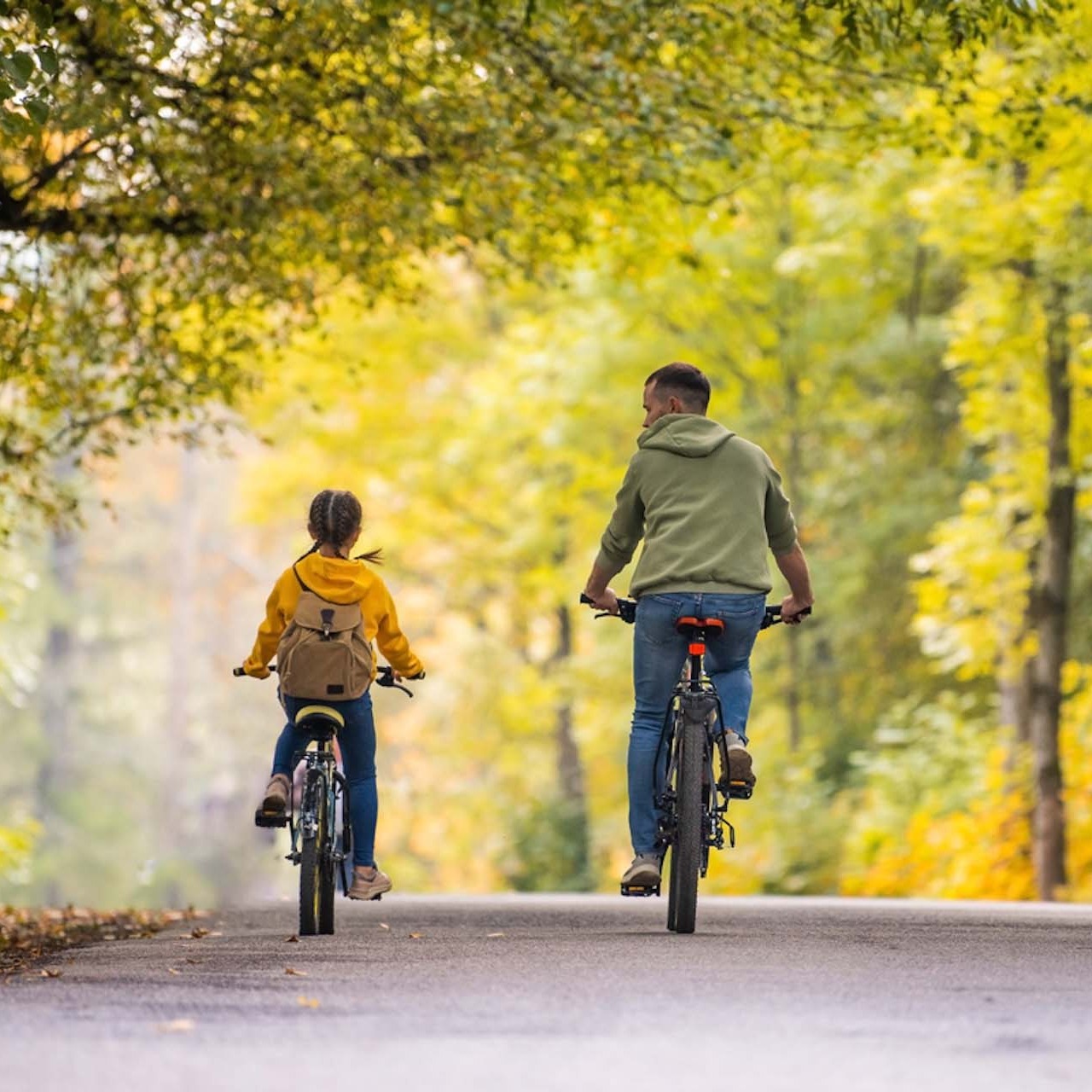 two-people-on-a-bike-SQUARE