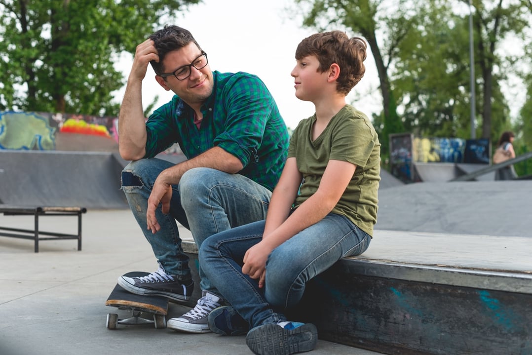young-boy-with-therapist-at-skatepark-1