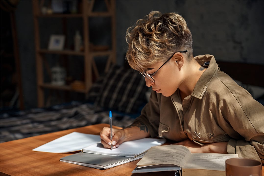 young-female-studying-in-dorm-room